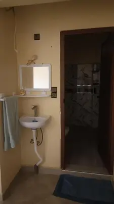 a bathroom with a sink and a glass shower at Casa caram in Hassilabied