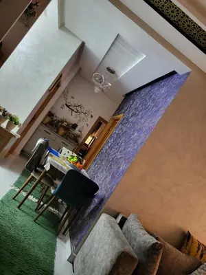 an overhead view of a living room with a purple curtain at Appartement de luxe in Meknès
