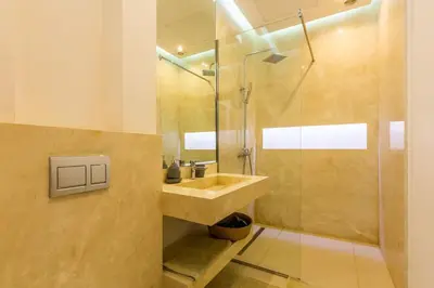 a bathroom with a sink and a shower at Villa Seyana 7 Zero Vis a Vis, Piscine Chauffee in Gzoula