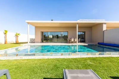 a swimming pool in the backyard of a house at Villa Seyana 7 Zero Vis a Vis, Piscine Chauffee in Gzoula