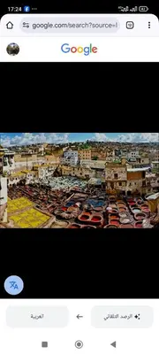 a view of a city with cars parked in a parking lot at Good life in Fès