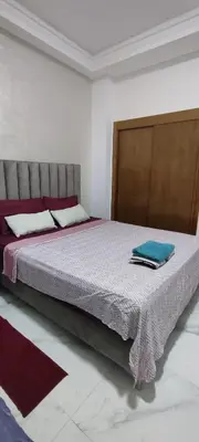 a bedroom with a large bed in a room at Good life in Fès