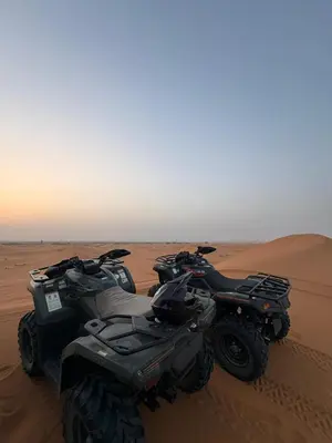 two atvs parked in the sand in the desert at chez zakaria luxury tent camp merzouga in Merzouga