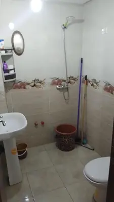 a bathroom with a shower and a toilet and a sink at 2 bedroom apartment for rent in Meknès