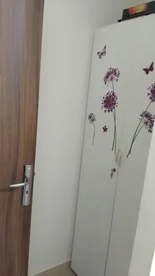 a white refrigerator with butterflies and flowers on it at 2 bedroom apartment for rent in Meknès