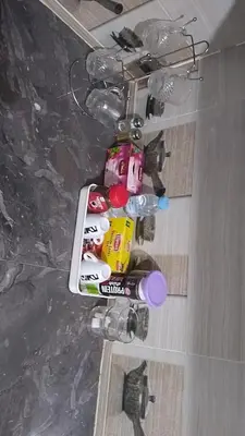 a chandelier with a bunch of water bottles at 2 bedroom apartment for rent in Meknès