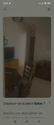 a picture of a living room with a desk and a chair at Kamelia Ifrane in Ifrane