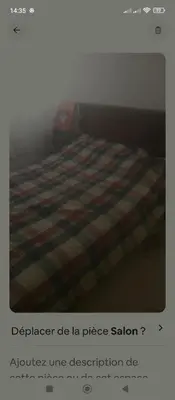 a picture of a bed with a striped blanket at Kamelia Ifrane in Ifrane