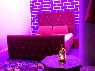 a living room with a couch and a table at Youth housing EL HABIB in Fès