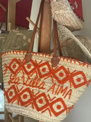 a handbag with the words nova nova addiction written on it at Villa AIMA - avec Gourvernante in Douar Soukkane