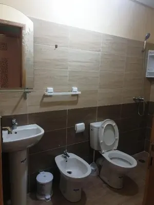 a bathroom with a toilet and a sink at Charmant appart proche Ain Asserdoun Béni Mellal in Oulad Akkou