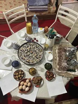 a table with many plates of food on it at Gite taymate in Zaouia Ben Smine