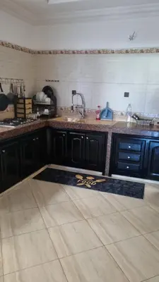 a kitchen with a sink and a counter at Bel appartement en plein Taza in Taza