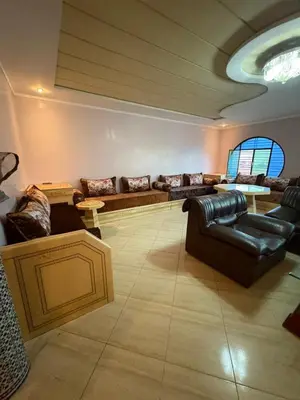 a large living room with couches and a table at Bel appartement en plein Taza in Taza
