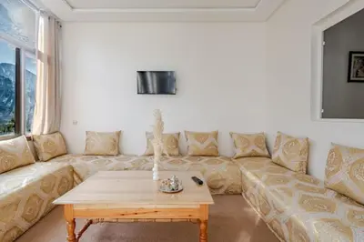 a living room with a couch and a coffee table at Maison authentique Ourika avec vue sur l'Atlas in Ourika