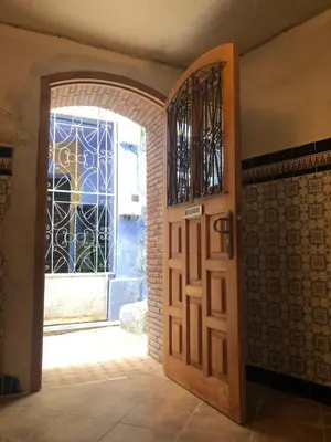 an entrance to a room with a door and a window at Dar Kakun in Oulad Akkou