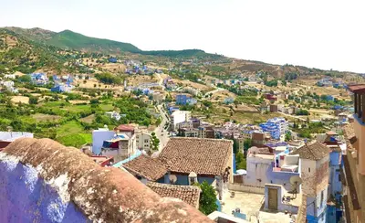 an aerial view of a town with blue buildings at Dar Kakun in Oulad Akkou