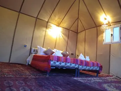 a room with a bed in a tent at Luxury Queen Camp in Tisserdmine