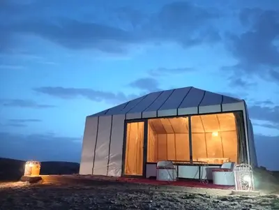 a large dome house with a table and chairs in it at Luxury Queen Camp in Tisserdmine