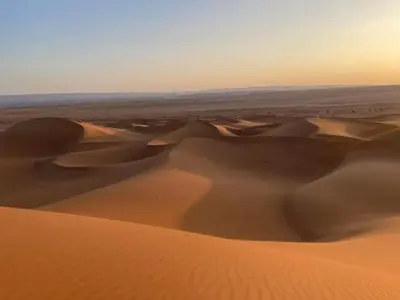 a view of a desert with sand dunes at Planet Camp Désert Tours in Mhamid