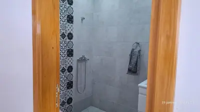 a bathroom with a shower with a toilet at maison 83 in Oulad Akkou