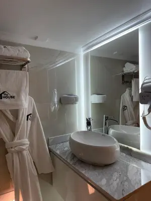 a bathroom with a sink and a mirror at Illy house in Ifrane