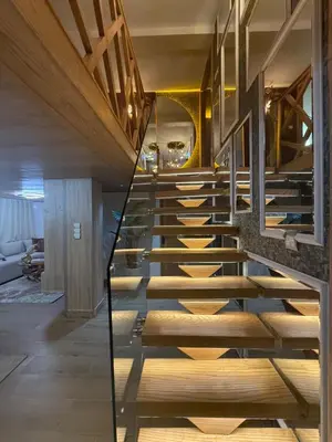 a staircase in a house with wooden steps at Illy house in Ifrane