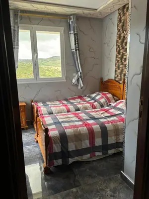a bedroom with a bed and a window at Absolute Calm & Panoramic Views in Oulad Akkou