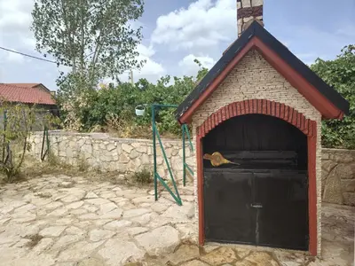 a small dog house with a black door at appartement lamia in Azrou