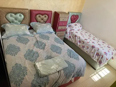 a bedroom with two beds with hearts on them at Cozy & Affordable Family Apartment for married couples only in Ifrane