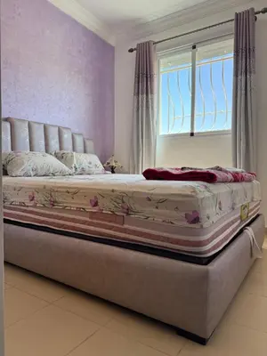 a large bed in a bedroom with a window at Cozy & Affordable Family Apartment for married couples only in Ifrane