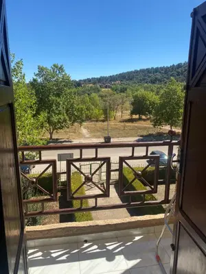 a balcony with a gate with a view of a parking lot at شقة فخمة وهادئة in Ifrane