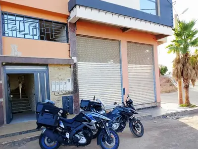 two motorcycles parked in front of a building at appartement moderne khenifra 2 in Khenifra