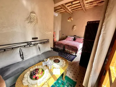a room with a table with a plate of fruit on it at Nana Diafa - Zagora Guest House & Restaurant in Zagora