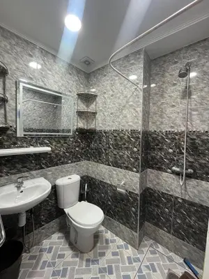 a bathroom with a toilet and a sink and a shower at Stylish & Spacious Apartment in Peaceful Ifrane in Ifrane