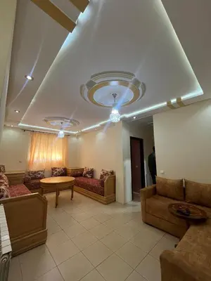 a large living room with couches and a table at Stylish & Spacious Apartment in Peaceful Ifrane in Ifrane