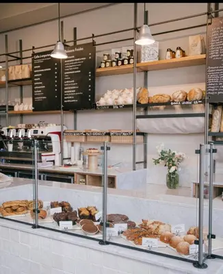a bakery with a bunch of pastries on display at CFC - Douceur et luminosité in Oulad Akkou