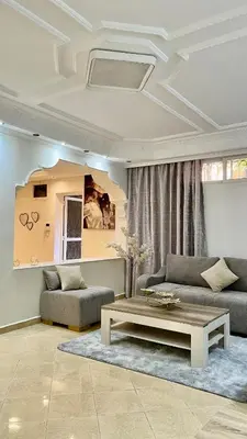 a living room with a couch and a coffee table at Marrakech Villa Floor Private Garden & Sport Space in Oulad Akkou