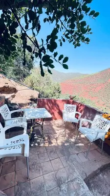 a group of chairs and a table on a patio at Chez Mazgiti in Ourika