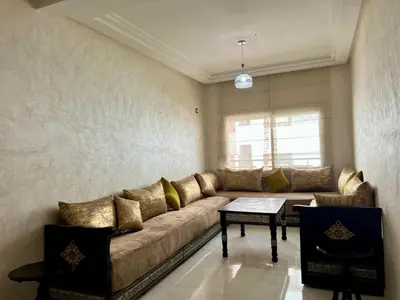 a living room with a couch and a table at Luxury Apartment - Fes Medina in Fès
