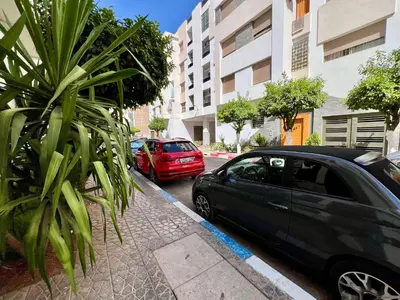 two cars parked on the side of a street at Luxury Apartment - Fes Medina in Fès
