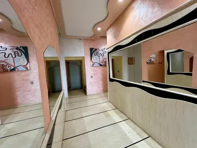 a hallway in a building with graffiti on the walls at Luxury Apartment - Fes Medina in Fès