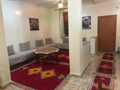 a living room with a couch and a table at Auberge Touristique Toubkal in Imlil