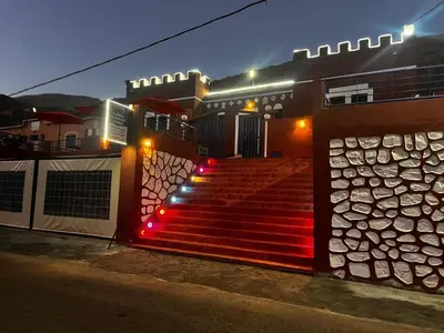 a set of stairs with red lights in front of a building at Auberge Touristique Toubkal in Imlil