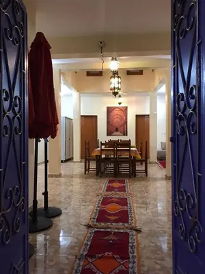 a room with a table and a dining room at Auberge Touristique Toubkal in Imlil
