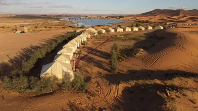 an aerial view of a desert with trees and a river at Bivouac Luxe Masandoia Meteorites in Lac Yasmins