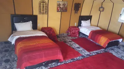 two beds sitting next to each other in a room at Bivouac Luxe Masandoia Meteorites in Lac Yasmins