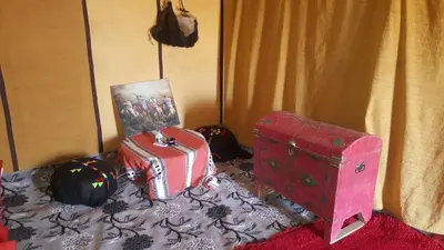 two suitcases sitting on top of a bed at Bivouac Luxe Masandoia Meteorites in Lac Yasmins