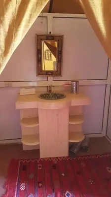 a dressing table in a room with a mirror at Bivouac Luxe Masandoia Meteorites in Lac Yasmins
