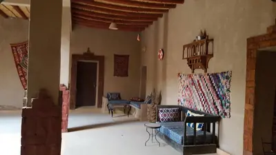 a living room with a couch and chairs at Secret du Sahara in Merzouga